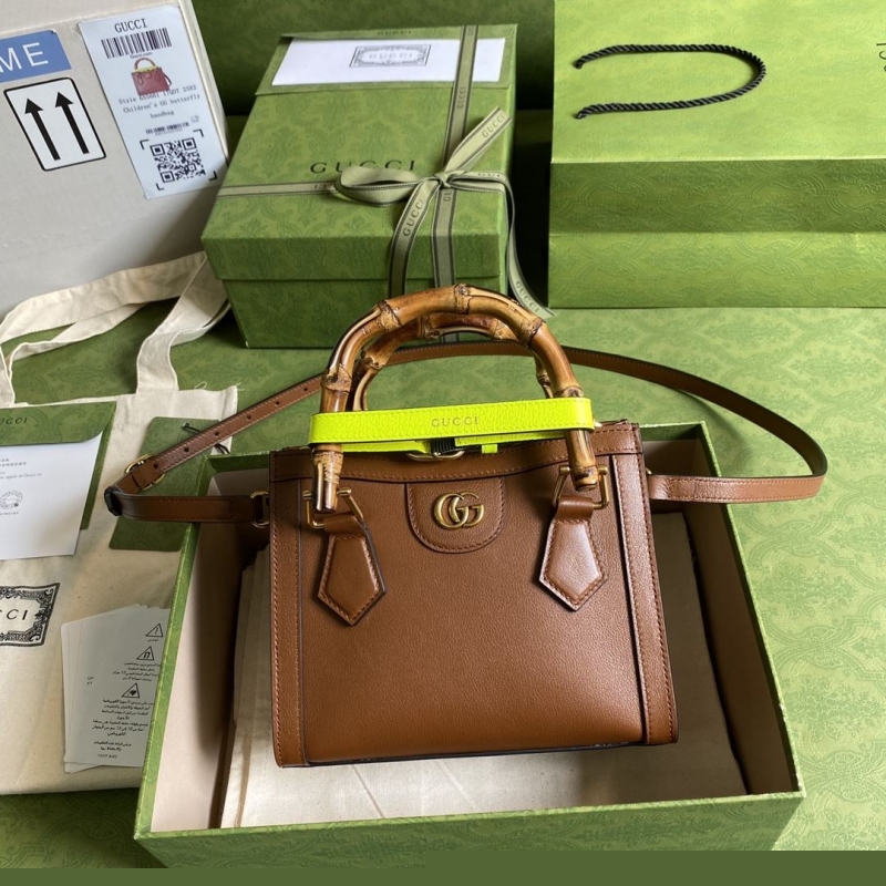 G*u*i top handle bags